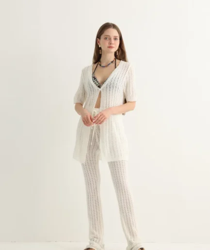 White open-knit beach set with longline top and flare pants